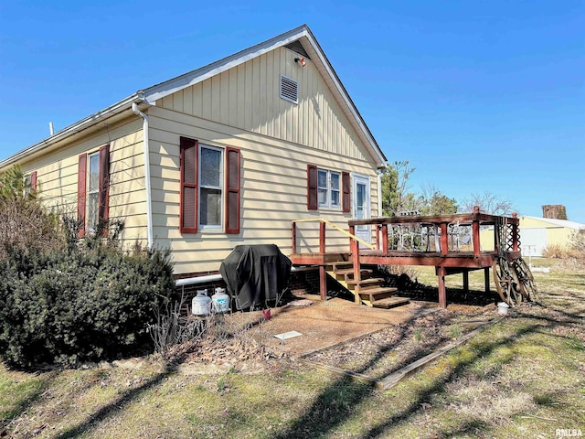 view of property exterior with a deck