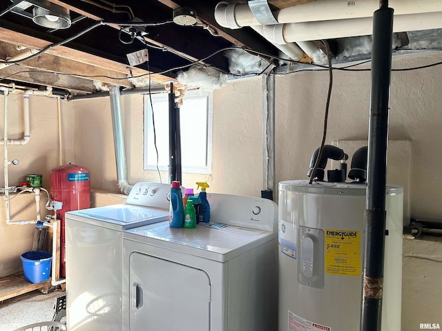 laundry area with water heater, laundry area, and washing machine and clothes dryer