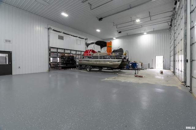 garage with visible vents and metal wall