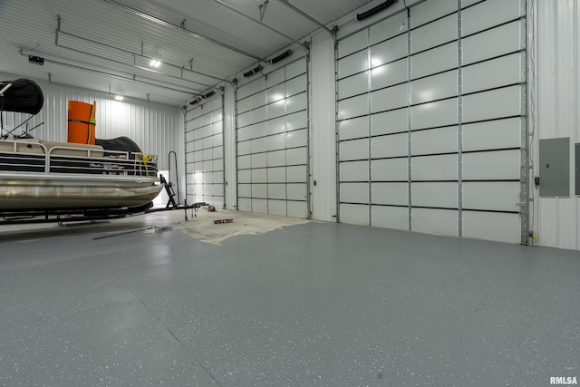 garage with electric panel and metal wall