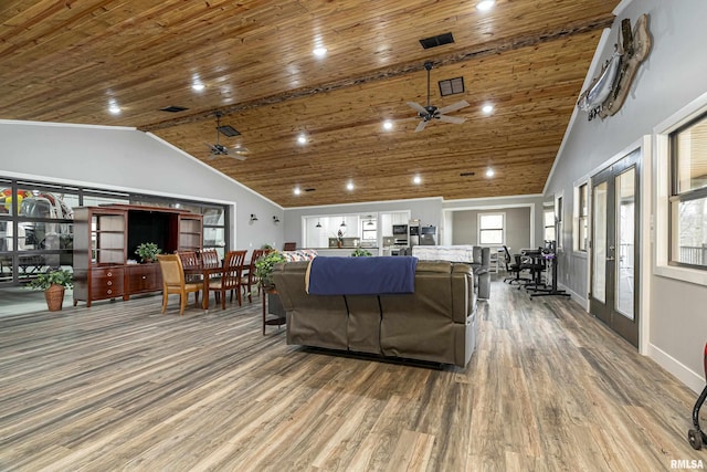 living room with a ceiling fan, wooden ceiling, wood finished floors, and high vaulted ceiling