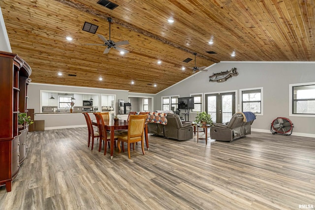 dining area featuring wood finished floors, wood ceiling, and french doors