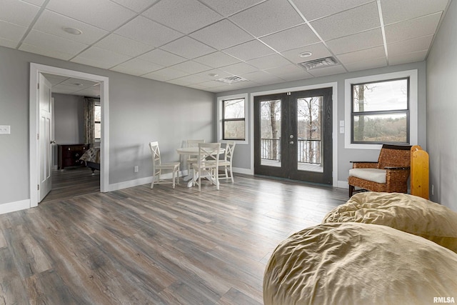 dining space featuring wood finished floors, french doors, and a wealth of natural light