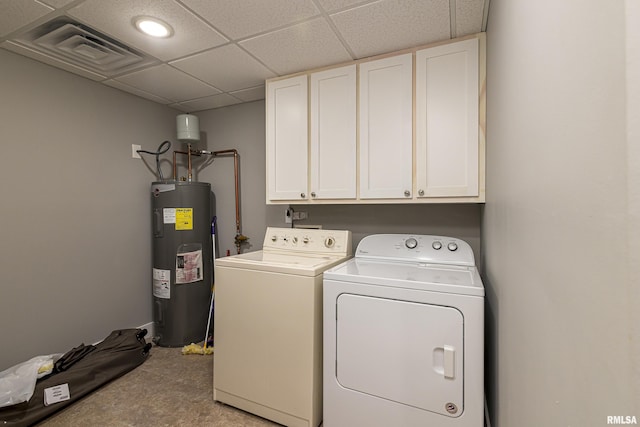 laundry area with visible vents, cabinet space, electric water heater, and washing machine and dryer