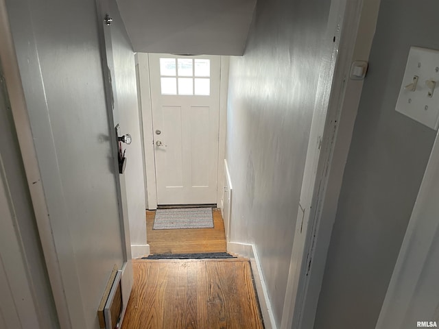 doorway featuring wood finished floors and visible vents