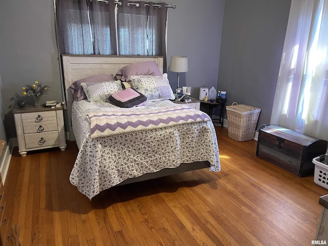 bedroom with wood finished floors