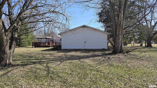 view of yard with a wooden deck