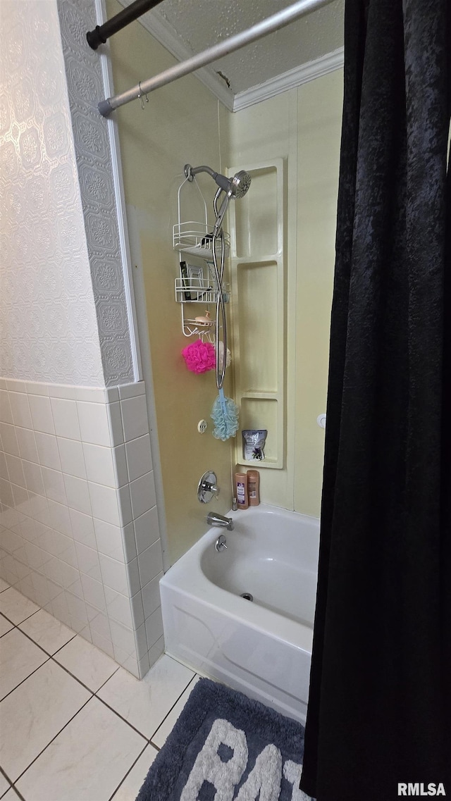 full bathroom with tile patterned flooring, tub / shower combination, wallpapered walls, ornamental molding, and tile walls