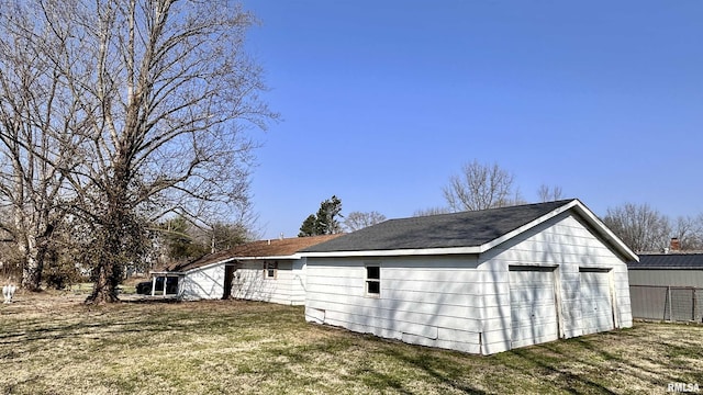 view of home's exterior featuring a yard and a garage