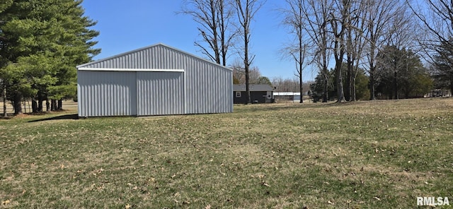 view of yard featuring an outbuilding, a detached garage, and an outdoor structure