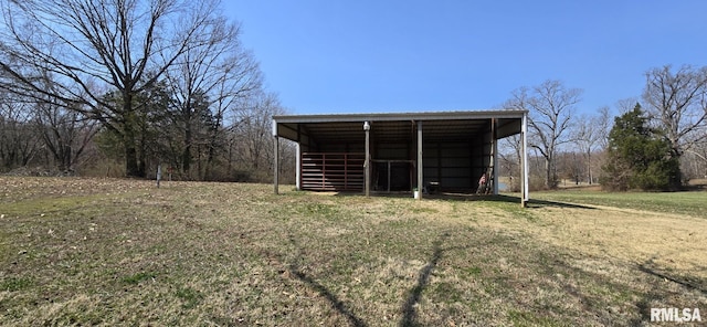 view of pole building with a lawn