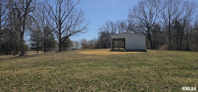 view of yard featuring an outbuilding and a pole building