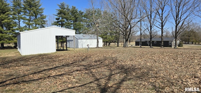 view of yard featuring an outbuilding and an outdoor structure