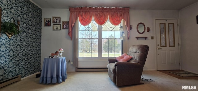 sitting room with crown molding, carpet, and a baseboard radiator