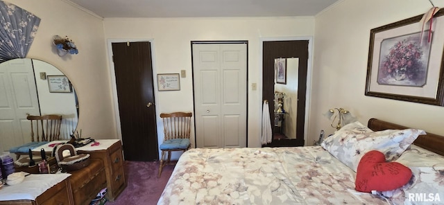 bedroom featuring multiple closets, dark carpet, and ornamental molding