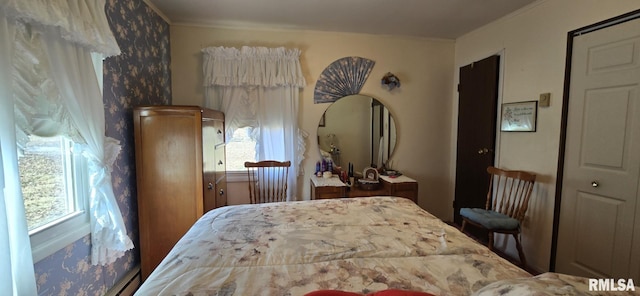 bedroom featuring multiple windows and ornamental molding