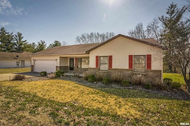 ranch-style home featuring brick siding, an attached garage, concrete driveway, and a front lawn