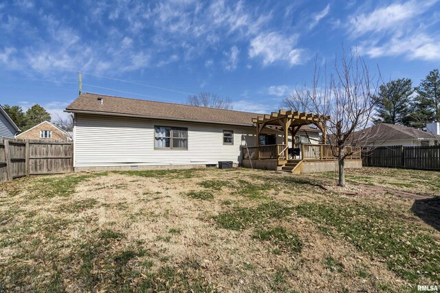 back of house with crawl space, a deck, a pergola, and a fenced backyard