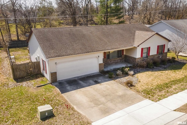 single story home with concrete driveway, fence, a garage, and a shingled roof