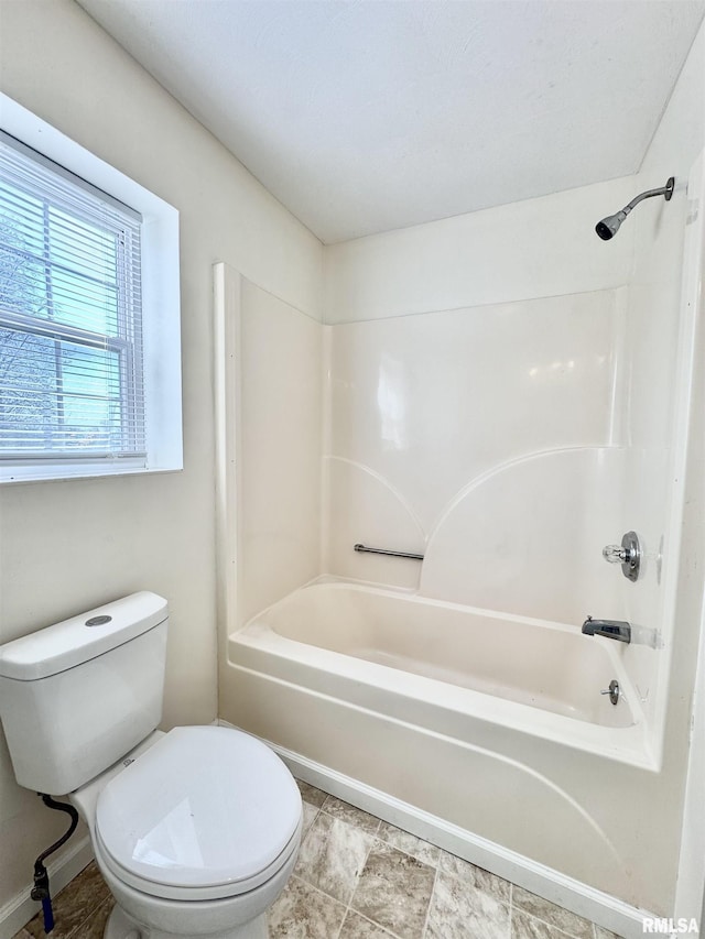 full bathroom featuring toilet and washtub / shower combination