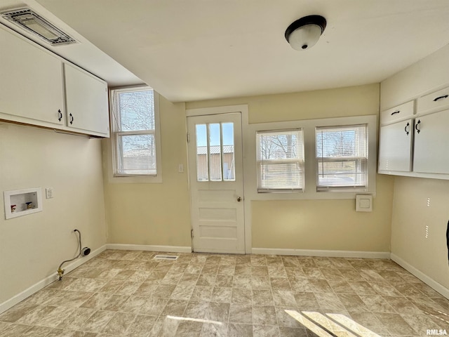 washroom featuring visible vents, cabinet space, hookup for a washing machine, and baseboards