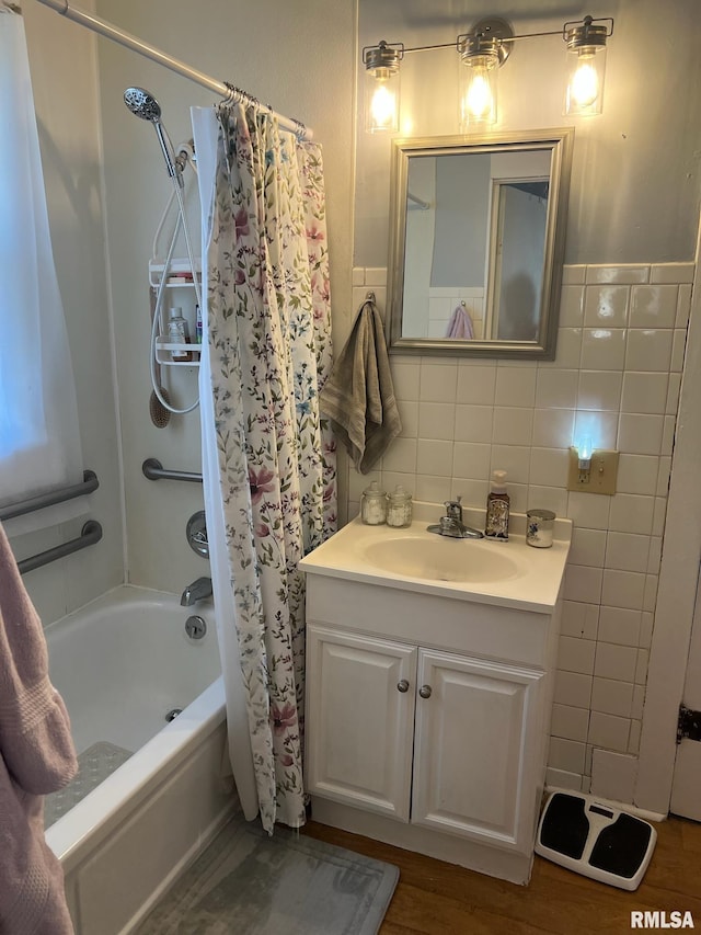 full bathroom featuring tile walls, vanity, and shower / bath combination with curtain