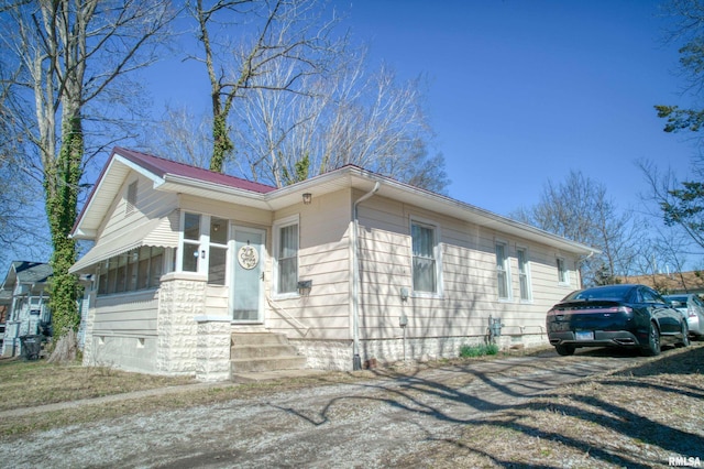 view of property exterior with entry steps