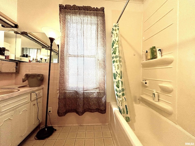 full bath with vanity, tile walls, tile patterned floors, and shower / tub combo with curtain