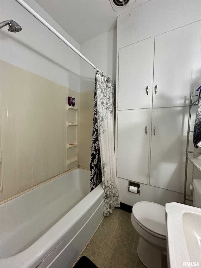 full bathroom with toilet and shower / bath combo