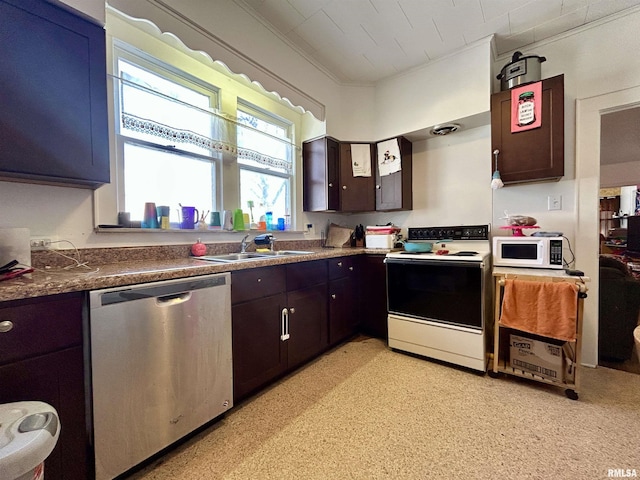 kitchen featuring dark brown cabinets, ornamental molding, white appliances, and a sink