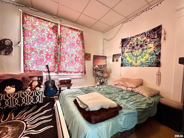 bedroom featuring a drop ceiling