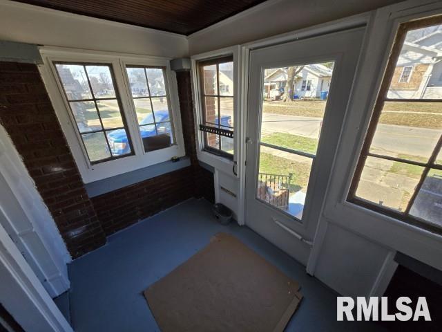 doorway with concrete floors