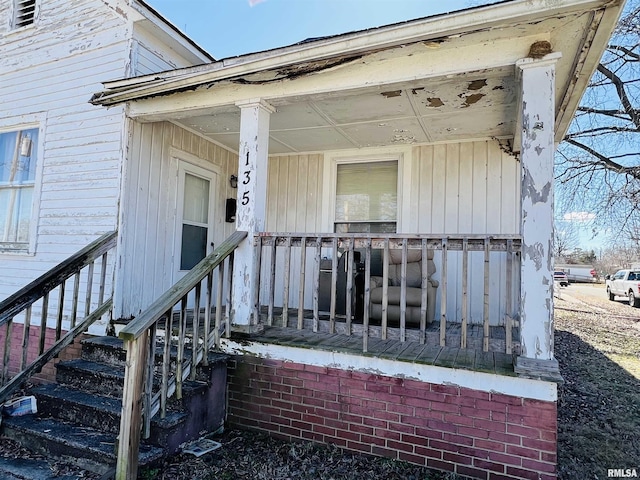 entrance to property with a porch