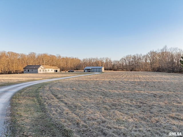 2814 Chouteau Ave, Odin, IL 62870 - view of yard featuring a view of trees, an outbuilding, a garage, and an outdoor structure