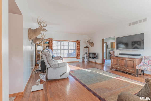 2814 Chouteau Ave, Odin, IL 62870 - living area with light wood finished floors, baseboards, and visible vents