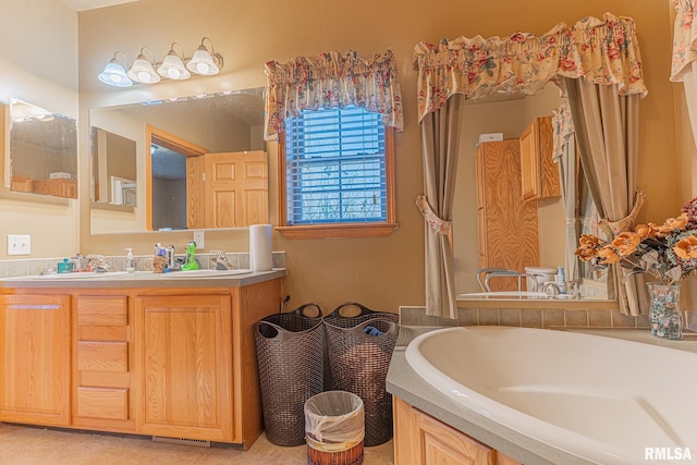 2814 Chouteau Ave, Odin, IL 62870 - bathroom featuring a sink, tile patterned floors, double vanity, and a garden tub