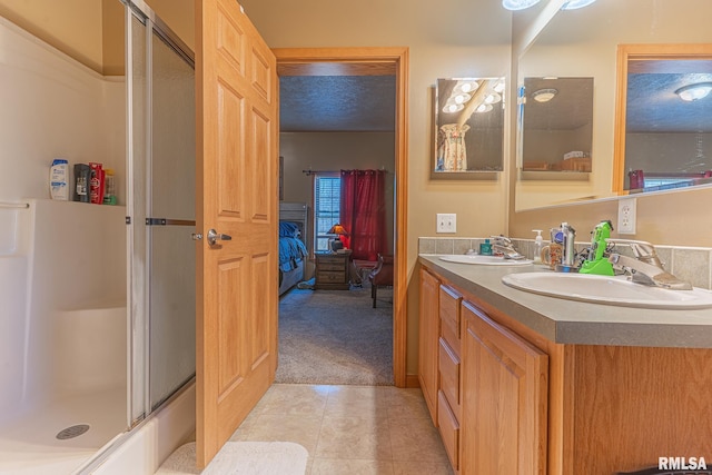 2814 Chouteau Ave, Odin, IL 62870 - full bathroom featuring ensuite bathroom, a sink, a shower stall, double vanity, and tile patterned floors