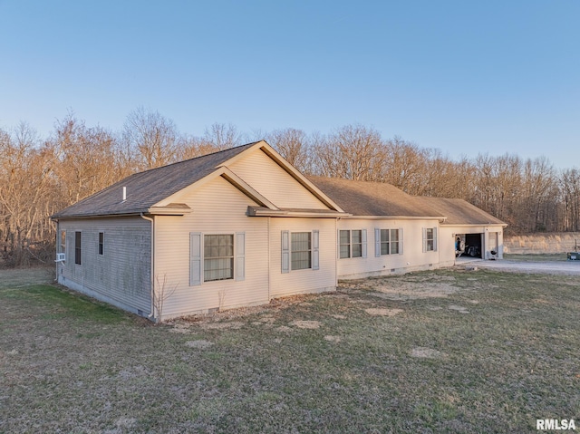 2814 Chouteau Ave, Odin, IL 62870 - view of side of home featuring crawl space, a shingled roof, and a lawn