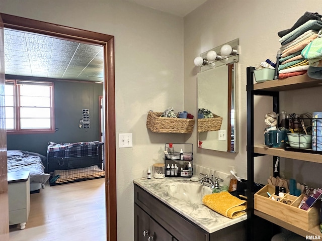 bathroom featuring vanity and wood finished floors