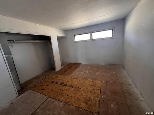 unfurnished bedroom with a closet