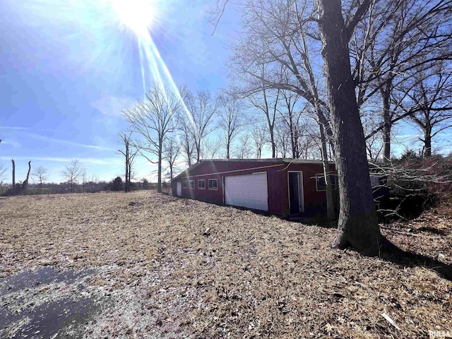 exterior space featuring an outbuilding and a garage