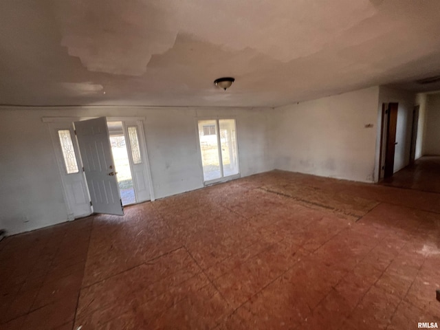 spare room featuring plenty of natural light