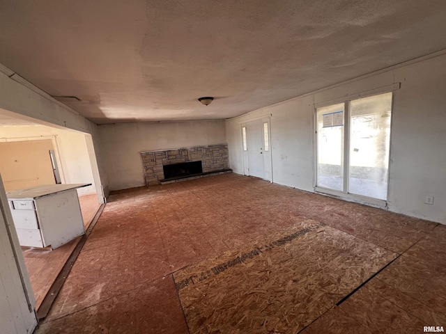 unfurnished living room featuring a fireplace