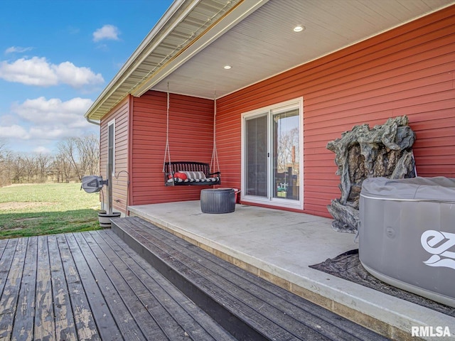 wooden terrace with a lawn