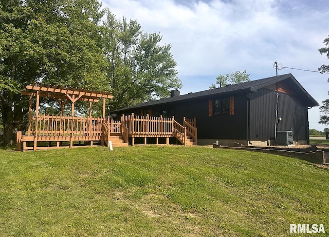 15563 State Highway 149, West Frankfort, IL 62896 - back of property with a yard, a wooden deck, a chimney, and cooling unit