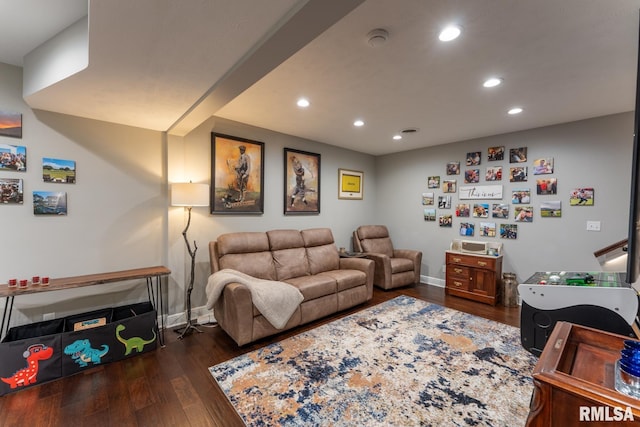 living room featuring recessed lighting, baseboards, and dark wood-type flooring