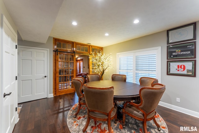 dining room with recessed lighting, baseboards, and wood finished floors