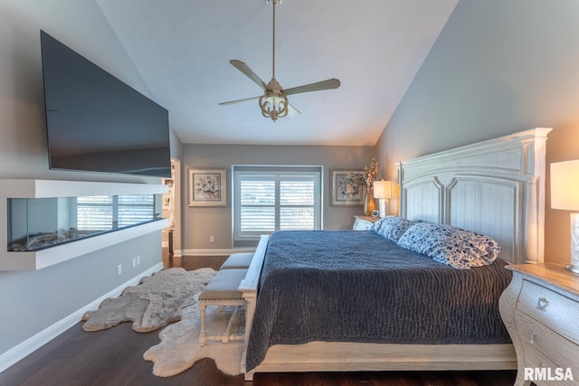 bedroom featuring a ceiling fan, vaulted ceiling, wood finished floors, and baseboards
