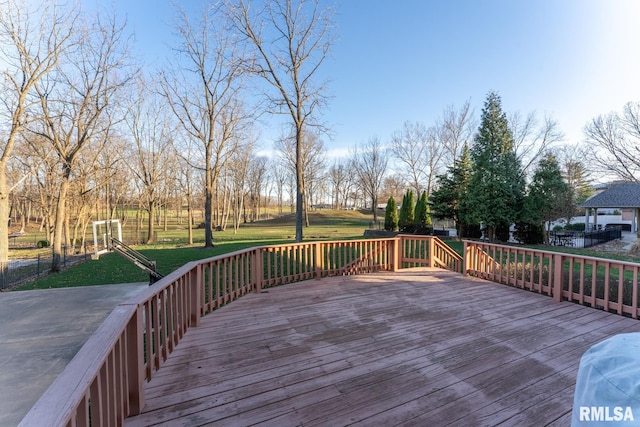 wooden deck with a lawn