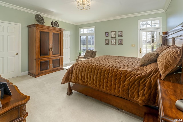 bedroom featuring ornamental molding, baseboards, and light carpet